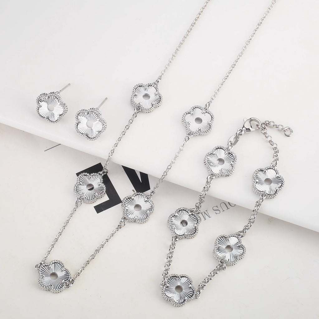 Hollow Metal Double sided Hollow Jewelry Set Sparkling Hot Selling Plum Blossom Jewelry Set Creative New Design For Women Clover