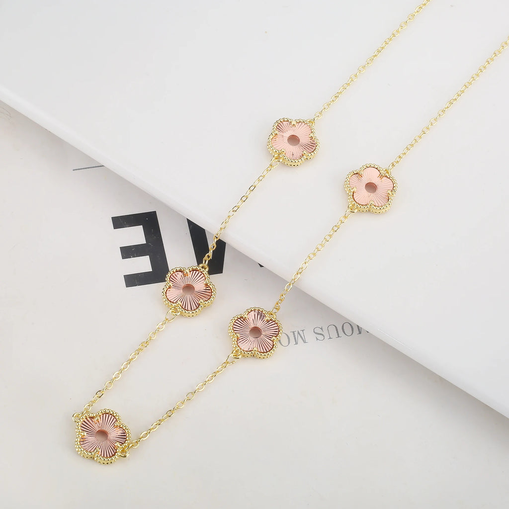 Hollow Metal Double sided Hollow Jewelry Set Sparkling Hot Selling Plum Blossom Jewelry Set Creative New Design For Women Clover