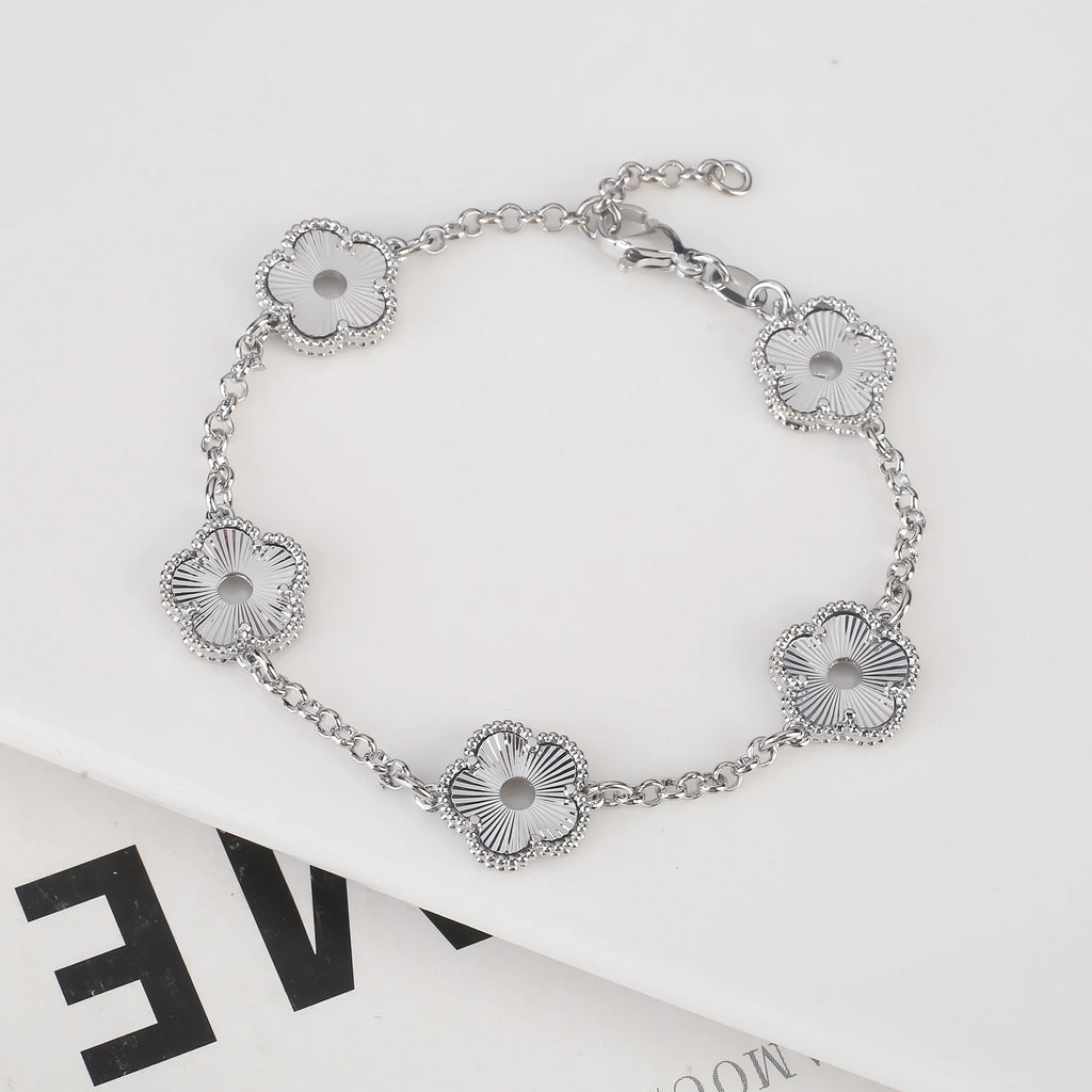 Hollow Metal Double sided Hollow Jewelry Set Sparkling Hot Selling Plum Blossom Jewelry Set Creative New Design For Women Clover