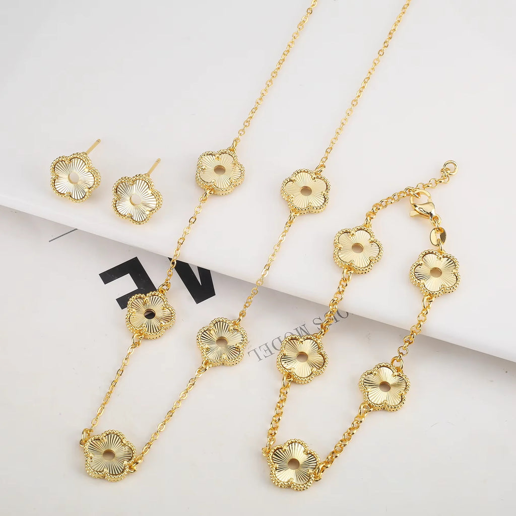 Hollow Metal Double sided Hollow Jewelry Set Sparkling Hot Selling Plum Blossom Jewelry Set Creative New Design For Women Clover