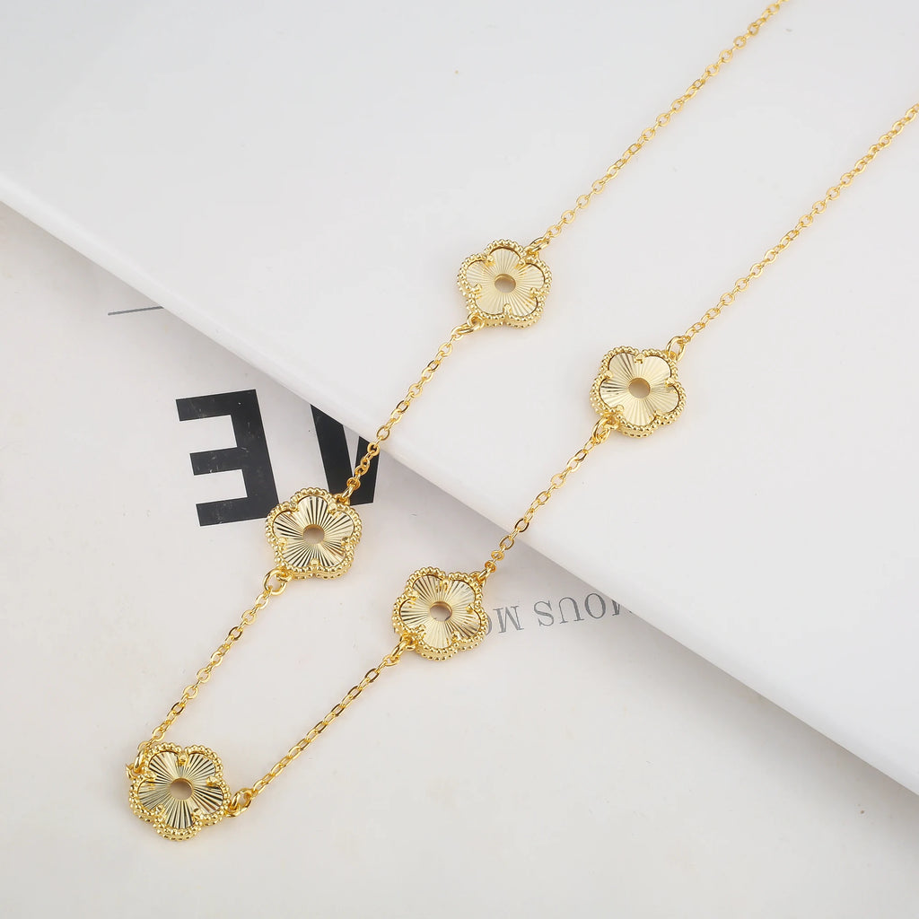 Hollow Metal Double sided Hollow Jewelry Set Sparkling Hot Selling Plum Blossom Jewelry Set Creative New Design For Women Clover