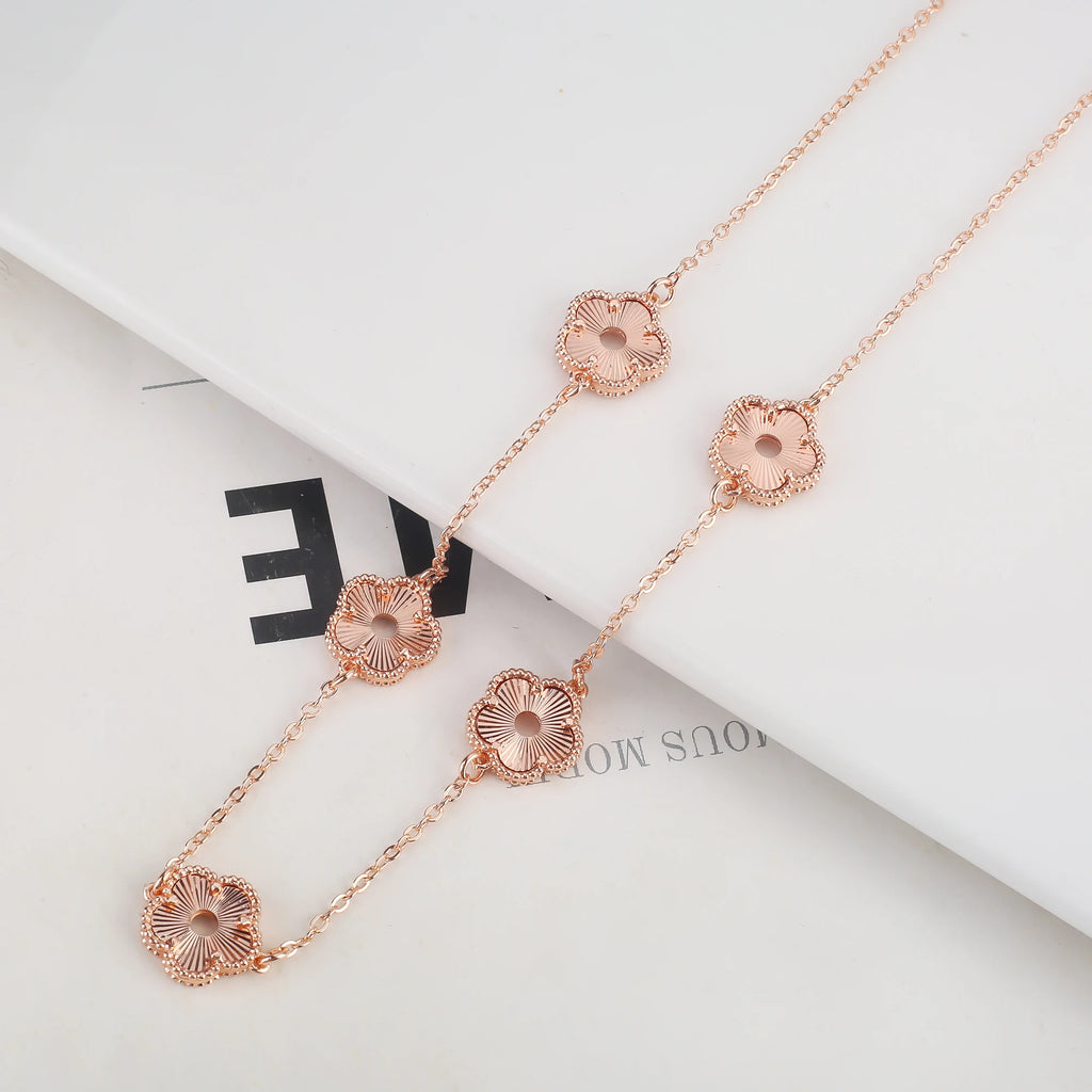 Hollow Metal Double sided Hollow Jewelry Set Sparkling Hot Selling Plum Blossom Jewelry Set Creative New Design For Women Clover