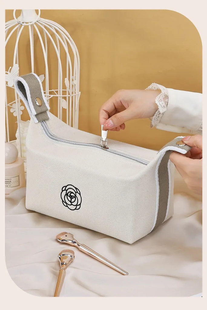 Premium Handheld Camellia Canvas Makeup Bag – Large‑Capacity Travel Toiletry & Skincare Organizer