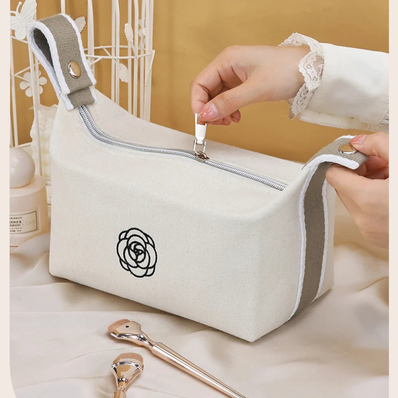 Premium Handheld Camellia Canvas Makeup Bag – Large‑Capacity Travel Toiletry & Skincare Organizer