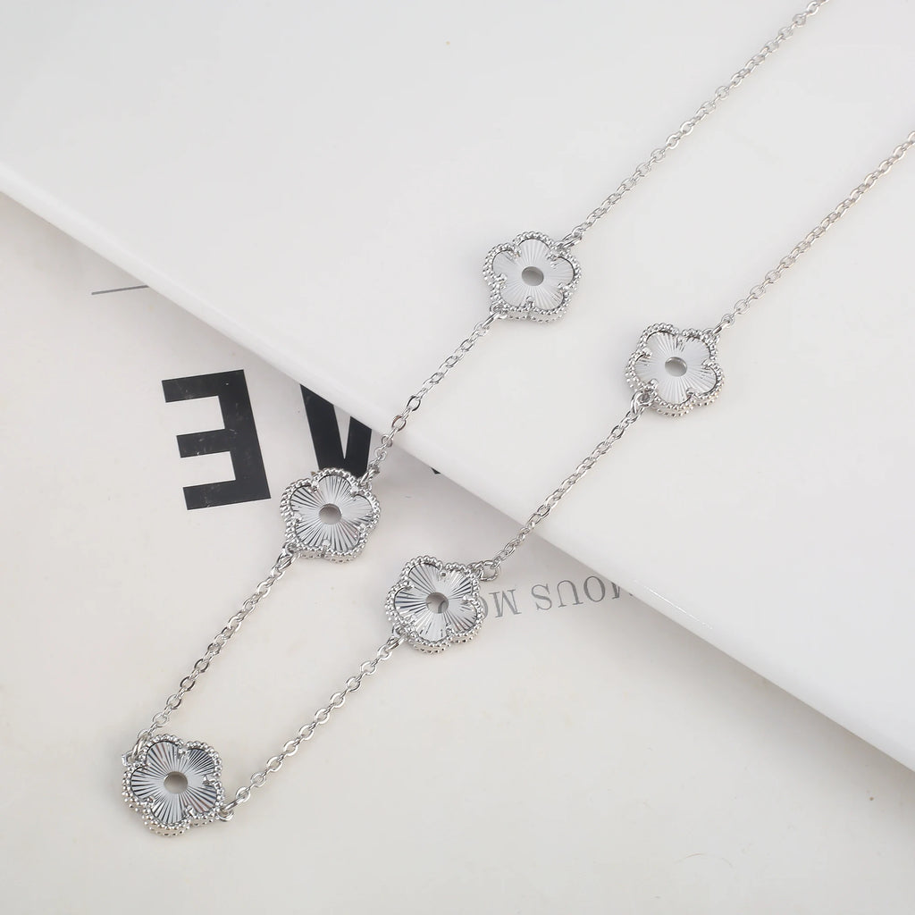 Hollow Metal Double sided Hollow Jewelry Set Sparkling Hot Selling Plum Blossom Jewelry Set Creative New Design For Women Clover
