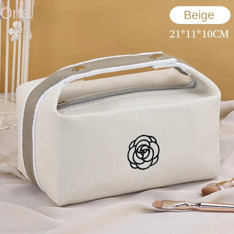 Premium Handheld Camellia Canvas Makeup Bag – Large‑Capacity Travel Toiletry & Skincare Organizer