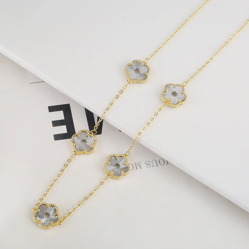 Hollow Metal Double sided Hollow Jewelry Set Sparkling Hot Selling Plum Blossom Jewelry Set Creative New Design For Women Clover